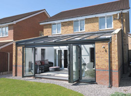 Glass roof extension with bi-folding doors