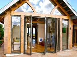 Extension with bi-folding glass panel door